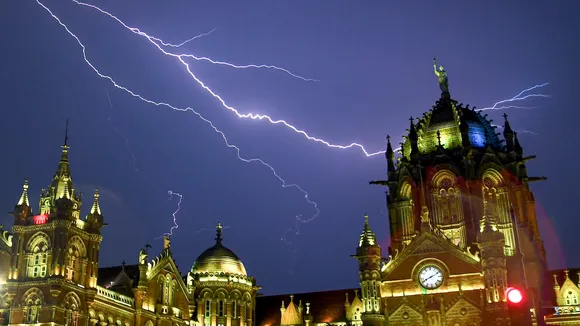 Thunderstorm lights up the sky above the Chhatrapati Shivaji Terminus during pre-monsoon rains in Mumbai on Tuesday, May 20, 2025.