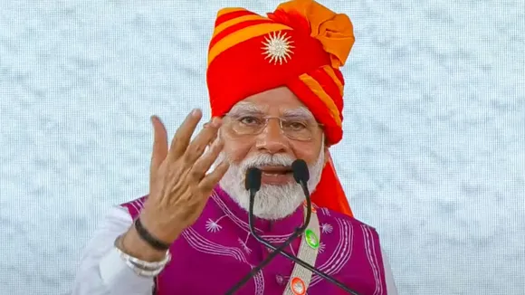 Prime Minister Narendra Modi addresses a public meeting during the inauguration of Loco Manufacturing Shop and various development projects, in Dahod