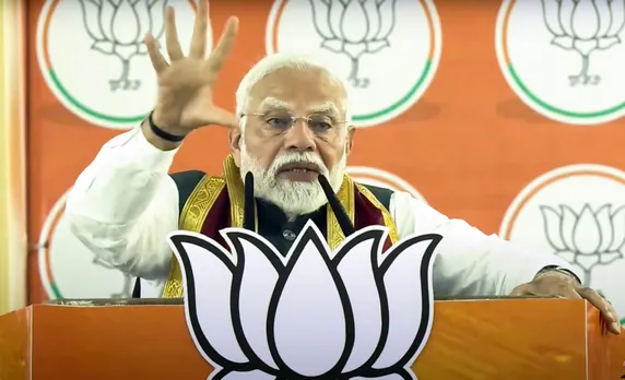 Prime Minister Narendra Modi addresses a public meeting, in Alipurduar, West Bengal.