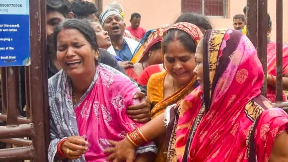 Family members of a victim mourn at a hospital after a stampede near Shree Gundicha Temple in Puri on Sunday, June 29, 2025.