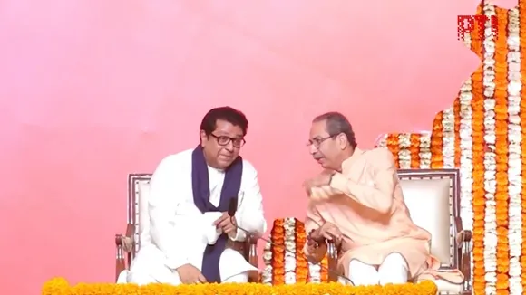 Uddhav (right) and Raj Thackeray shake hands as they hold a joint victory gathering, titled 'Awaj Marathicha' on Saturday, July 5, 2025.