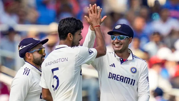 Washington Sundar celebrates with captain Shubman Gill after taking the wicket of England's batter Jamie Smith during the fourth day of the third Test match between India and England, at the Lord's Cricket Ground, in London, Sunday, July 13, 2025.