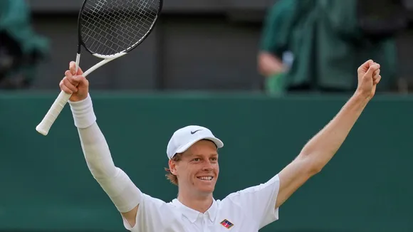 Italy's Jannik Sinner celebrates after beating Carlos Alcaraz of Spain to win the men's singles final at the Wimbledon Tennis Championships in London, Sunday, July 13, 2025.