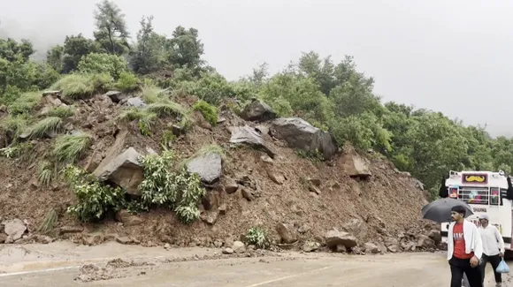 Debris scattered around after a landslide hits Jammu-Srinagar highway, in Udhampur