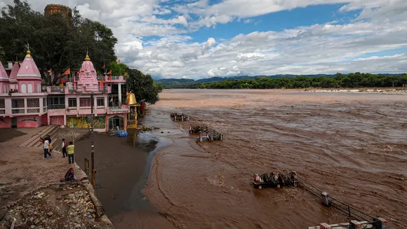 People near the Jio Pota Ghat temples after the water level of the Chenab river receded at Akhnoor on the outskirts of Jammu district on Thursday, Sept 4, 2025.