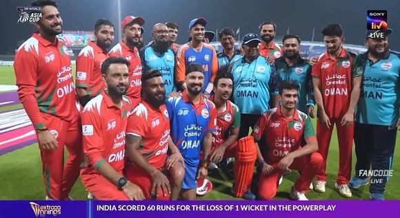 Suryakumar Yadav poses for a picture with Oman team
