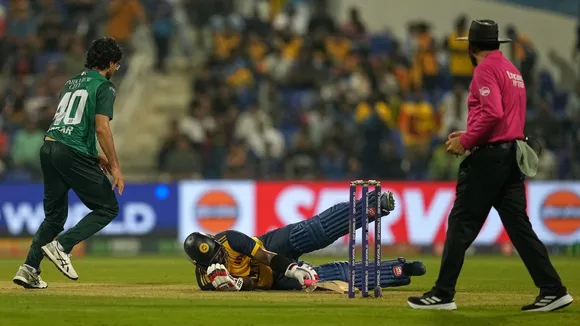Sri Lanka's Wanindu Hasaranga, lies on the ground after he was hit by a ball during the Asia Cup cricket match between Pakistan and Sri Lanka at Zayed Cricket Stadium in Abu Dhabi, United Arab Emirates, Tuesday, Sept. 23, 2025. AP/PTI