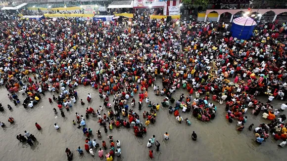 People perform rituals in the Ganga river on the last day of the 'Chhath Puja' festival celebrations, at Gandhi ghat, in Patna, Tuesday, Oct. 28, 2025.