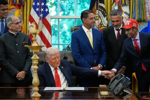 Donald Trump greets Timmy Cheedala during Diwali Celebrations at the White House on October 21, 2025.