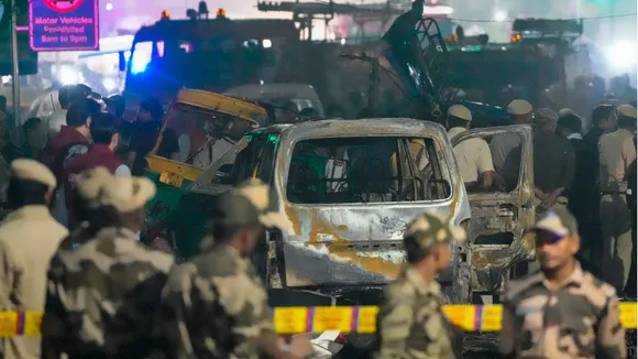 Security personnel at the spot after a blast occurred in a parked car near Red Fort, leaving multiple vehicles in flames, in New Delhi, Monday, Nov. 10, 2025.