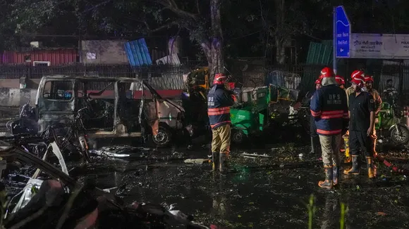 Firefighters at the spot after a blast occurred in a parked car near Red Fort, leaving multiple vehicles in flames, in New Delhi, Monday, Nov. 10, 2025. At least one person was killed in the incident.