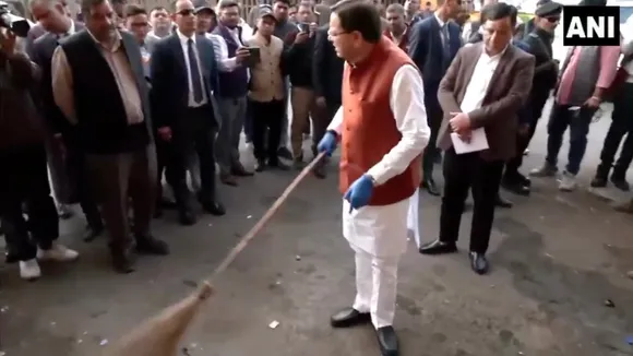 Pushkar Singh Dhami cleans ISBT Dehradun during a surprise inspection on Tuesday, Nov 18, 2025.