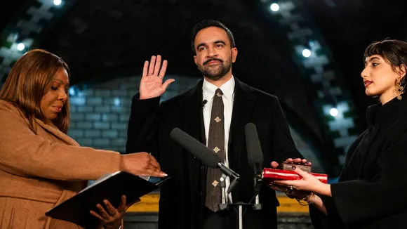 New York Attorney General Letitia James, left, administers the oath of office to mayor-elect Zohran Mamdani, center, as his wife Rama Duwaji looks on, Thursday, Jan. 1, 2026, in New York.