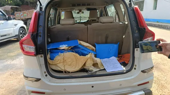 TMC claims it caught a vehicle trunk filled with hundreds of bundled blue files—likely Form 7 documents—outside an office, in Bankura, on Tuesday, January 13, 2026.