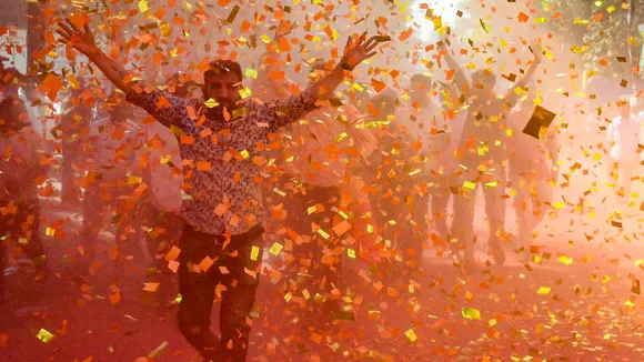 BJP workers celebrate amid confetti and gulal as they celebrate a party’s candidate’s victory in the Navi Mumbai Municipal Corporation (NMMC) elections, at Kopar Khairane, in Navi Mumbai, Maharashtra, Friday, Jan. 16, 2026.