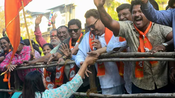 A Shiv Sena (Eknath Shinde faction) candidate greets supporters after victory in the Navi Mumbai Municipal Corporation elections outside the vote counting centre, in Navi Mumbai, Maharashtra, Friday, Jan. 16, 2026.