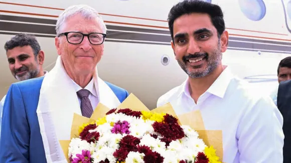 Andhra Pradesh HRD Minister Nara Lokesh, right, receives Former Microsoft CEO Bill Gates at Vijayawada International Airport, near Amaravati, Andhra Pradesh, on Monday, Feb 16, 2026.