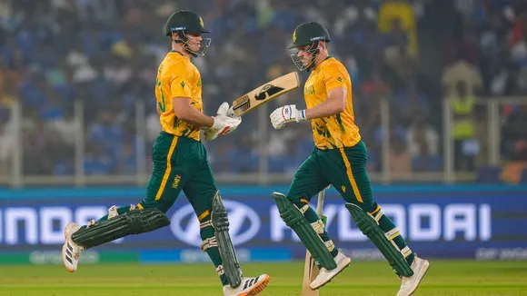 David Miller, right, and Tristan Stubbs run between the wickets during T20 World Cup 2026 cricket match in Ahmedabad on Sunday, Feb. 22, 2026.