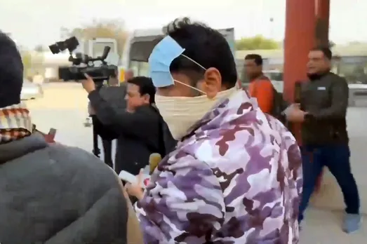 Delhi Police personnel escort arrested Indian Youth Congress (IYC) workers to the Civil Hospital for medical examination in connection with a protest at the AI Impact Summit in New Delhi, in Ambala, Haryana, Wednesday, Feb. 25, 2026.