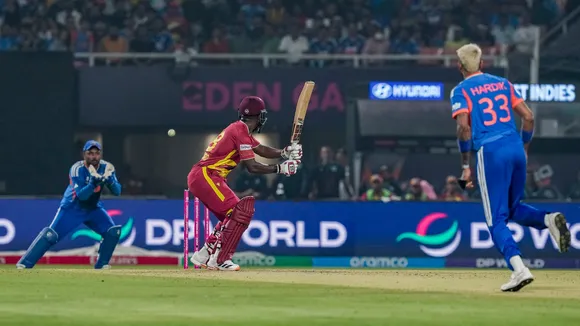 Sanju Samson, left, takes a catch of West Indies' Sherfane Rutherford, centre, during the ICC Men's T20 World Cup 2026 cricket match between India and West Indies, at the Eden Gardens, in Kolkata, West Bengal, Sunday, March 1, 2026.