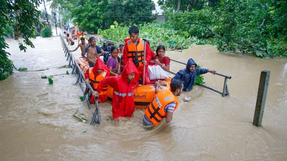 NDRF personnel evacuate people from a flood-affected area following heavy monsoon rainfall, at Adhaynagar village, on the outskirts of Agartala, Thursday, Aug. 22, 2024.