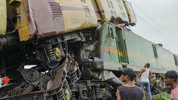 Locals gather after a collision between the Kanchanjungha Express and a goods train, near Rangapani railway station, on Monday, June 17, 2024.
