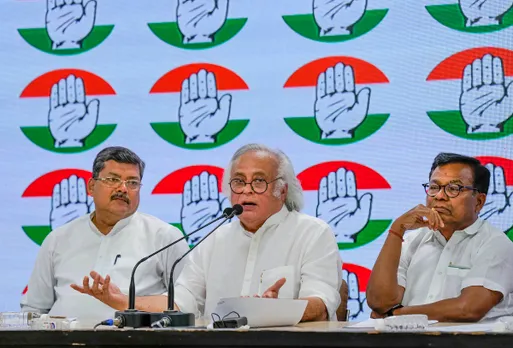 AICC General Secretary Jairam Ramesh (C) with party leaders Mukul Wasnik (L) and Bhakta Charan Das during a press briefing at the party headquarters, in New Delhi