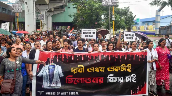 Medics take part in a protest march to Swasthya Bhavan over the alleged sexual assault and murder of a trainee doctor, in Kolkata, Sunday, Sept. 15, 2024.