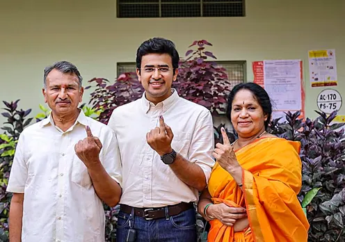 BJP MP Tejasvi Surya with his parents after casting votes for Karnataka Assembly elections, in Bengaluru