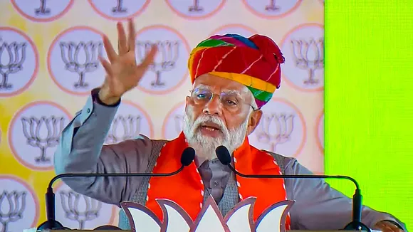 Prime Minister Narendra Modi addresses a public meeting, ahead of the upcoming Lok Sabha elections, in Karauli, Thursday, April 11, 2024