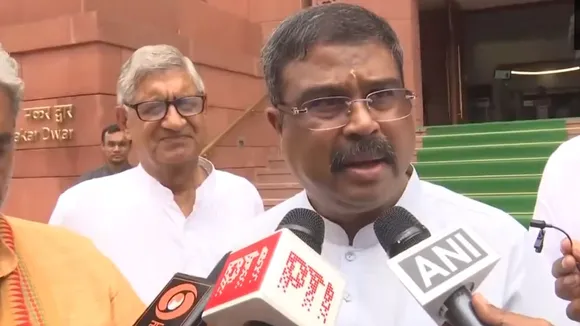 Union Education Minister Dharmendra Pradhan talking to reporters