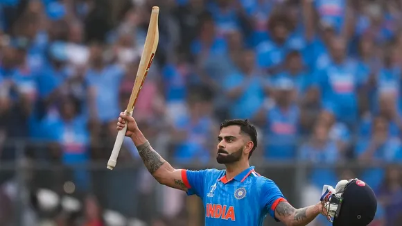  India's Virat Kohli celebrates his 50th century, breaking Sachin Tendulkar's most ODI hundreds record, during the ICC Men's Cricket World Cup 2023 semi-final match
