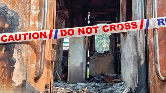 A damaged coach of the New Delhi-Darbhanga Special Express train after a fire on Wednesday, in Etawah district