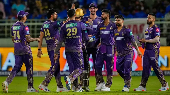 KKR's bowler Varun Chakravarthy with teammates celebrates the wicket of DC' Captain Rishabh Pant during the IPL 2024