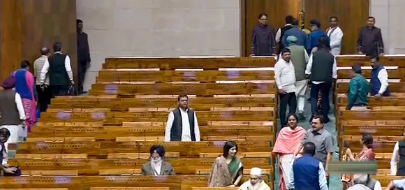 Opposition MPs walk out of the Lok Sabha during the Winter session of Parliament, in New Delhi, Wednesday, Dec. 6, 2023.