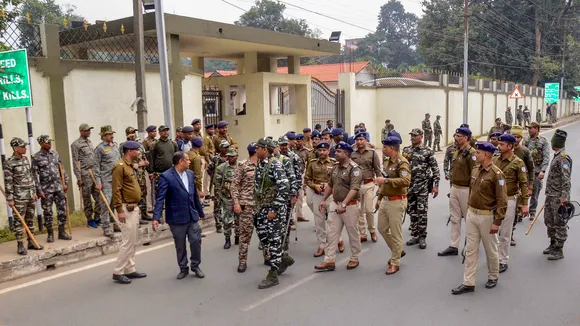 Senior police officers of Ranchi and CRPF personnel outside the residence of Jharkhand Chief Minister Hemant Soren