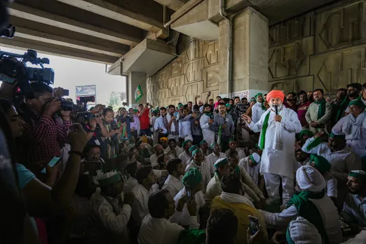 Bharatiya Kisan Union (BKU) leader Rakesh Tikait addresses farmers gathered near the Ghazipur border to join the wrestlers protesting against WFI chief Brij Bhushan Sharan Singh, in New Delhi, Sunday, May 28, 2023