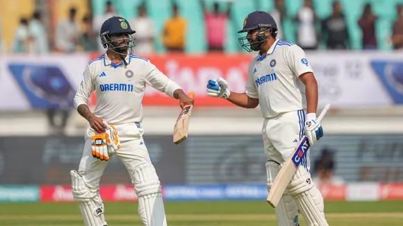 India's captain Rohit Sharma celebrates his century with Ravindra Jadeja on the first day of the third cricket test