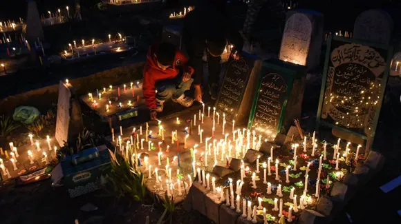 Shia Muslims light candles and offer fatiha at the graves of their loved ones on Shab-e-Barat in Srinagar