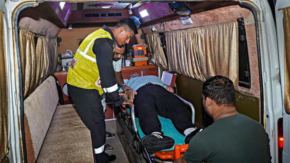 Indian Coast Guard personnel carry out a mid-sea medical evacuation of a Chinese national from a Panama-flagged research vessel, MV Dong Fang Kan Tan No 2, amid challenging weather conditions, in the Arabian Sea off Mumbai, early Thursday, Aug. 17, 2023