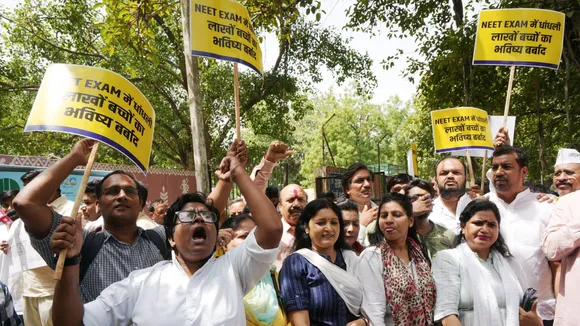 Members of AAP youth and student's wing stage a protest against the alleged irregularities in NEET 2024 exam results, near Education Minister Dharmendra Pradhan's residence, in New Delhi, Wednesday, June 19, 2024.