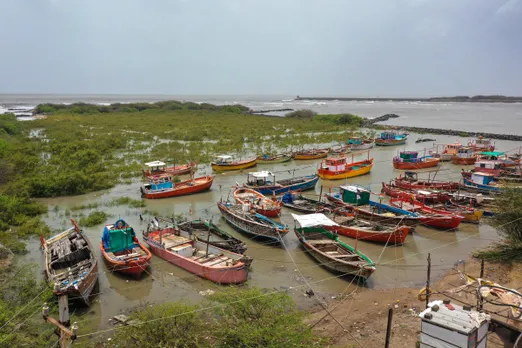 An aerial view of fishing boats anchored outside Mandvi port ahead of Cyclone Biparjoy's landfall, in Kutch district