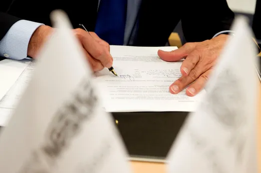 Pact signing agreement partnership.jpg