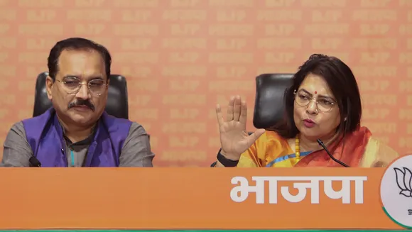 Union Minister Meenakashi Lekhi with Delhi BJP President Virendra Sachdeva addresses a press conference, in New Delhi