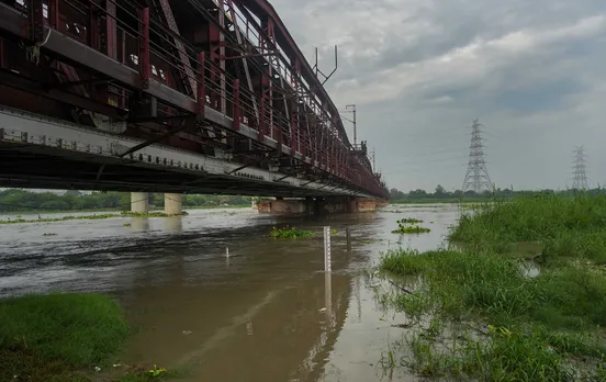 The Yamuna River swells up as its water level reaches near danger mark, at the Old Yamuna Bridge (Loha Pul), in New Delhi, Monday.jpg
