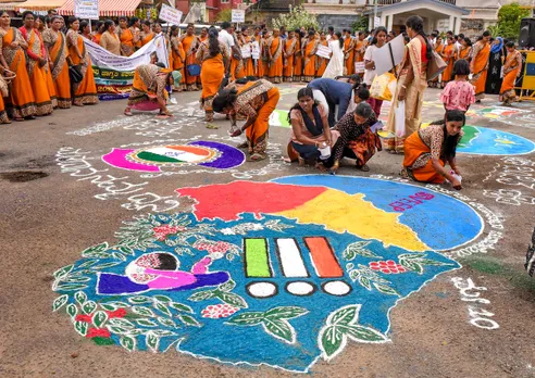 District administration workers create a 'rangoli' to spread voting awareness ahead of upcoming Karnataka Assembly elections