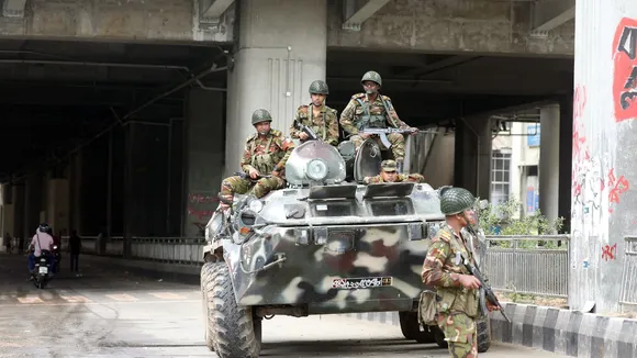 Bangladeshi Army soldiers patrol on the street after the government imposed a new curfew, in Dhaka