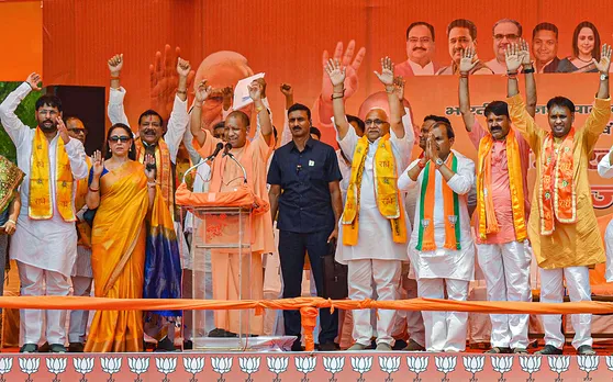 Uttar Pradesh Chief Minister Yogi Adityanath with BJP MP Hema Malini and other leaders during a public meeting in support of BJP candidate ahead of UP Municipal elections, in Mathura