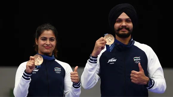 Bronze medalists Manu Bhaker and Sarabjot Singh of India pose during the medal ceremony for the 10m Air Pistol Mixed Team event