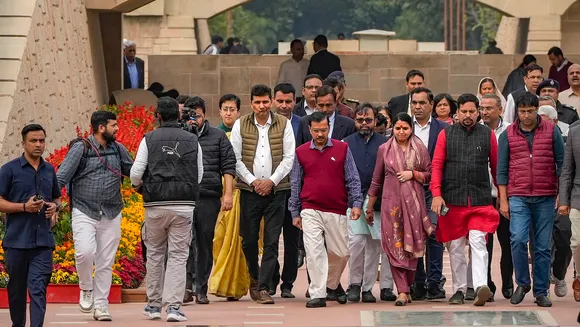 Delhi Chief Minister and AAP leader Arvind Kejriwal with cabinet ministers and party legislators leaves after visiting Rajghat to mark one year of party leader Manish Sisodia's arrest, in New Delhi